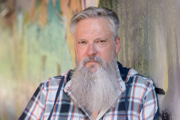 Attractive grey-haired bearded middle-aged man