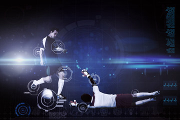 Football players tackling for the ball against blue dots on black background