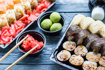 Sushi set: sushi roll with salmon and sushi roll with smoked eel, selective focus.