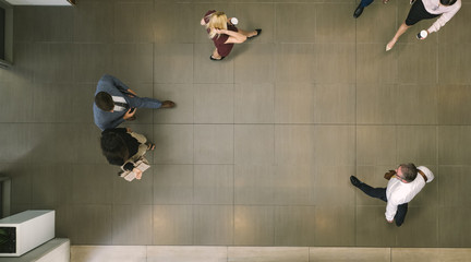 Businesspeople walking through a office hallway