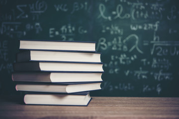  book with green board background