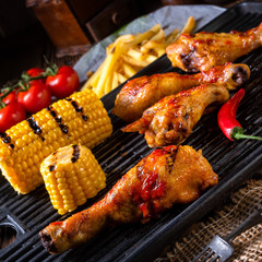 Rustic Grilled chicken wings,legs,and spicy corn