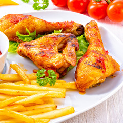 Grilled chicken wings,legs,chips and vegetables