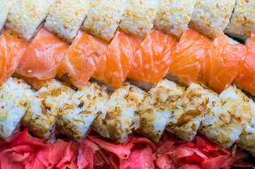Sushi set: sushi roll with salmon and sushi roll with smoked eel, selective focus.