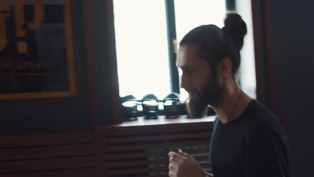 Two adult warrior practicing kung fu skills in training hall