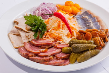 Plate with snacks for beer and herring
