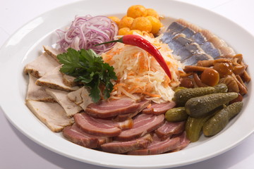 Plate with snacks for beer and herring