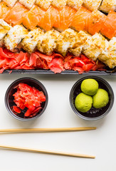 Sushi set: sushi roll with salmon and sushi roll with smoked eel, selective focus.