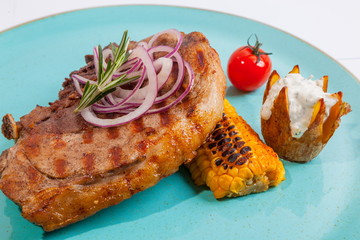 Steak on colored plate