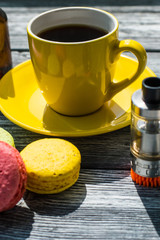Still life with e-cig and jiuce on the wooden background