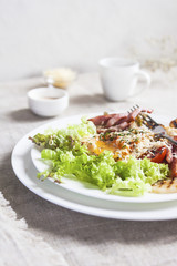 Breakfast salad with poached egg. Close up. Selective focus.