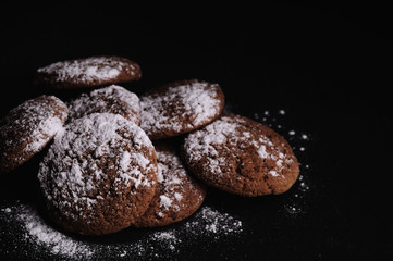 oatmeal cookies on a black table in castor sugar