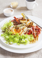 Breakfast salad with poached egg. Close up. Selective focus.