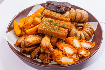 Grilled sausages on a plate with sauce