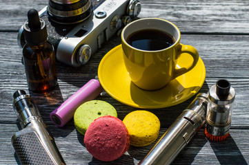Still life with e-cig and jiuce on the wooden background
