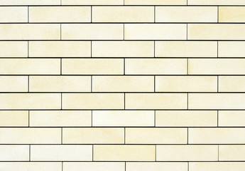 The average texture of the walls are light yellow bricks. Background.