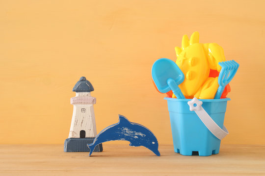 vacation and summer banner with sea life style objects and beach toys for kid.