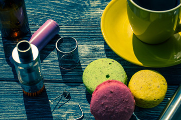 Still life with e-cig and jiuce on the wooden background