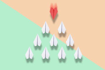 red paper plane leading white ones, leadership concept