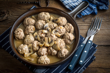 Delicious homemade swedish meatballs with mushroom cream sauce. Small depth of field.