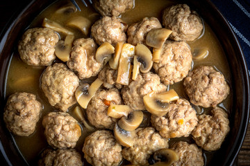 Delicious homemade swedish meatballs with mushroom cream sauce. Small depth of field.