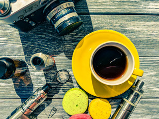 Still life with e-cig and jiuce on the wooden background