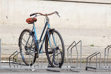 Fototapeta na wymiar Bicycle parked in the street on the bicycle rack