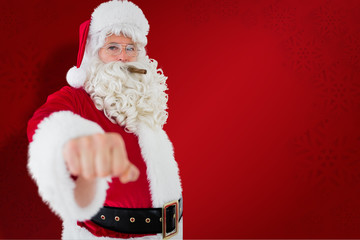 Portrait of santa with cigar against red snowflake background