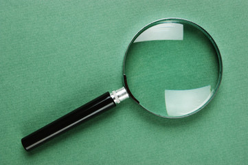 magnifying glass on green background