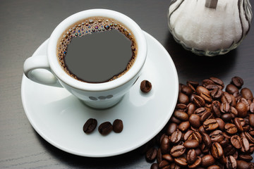 pile of coffee beans and a cup