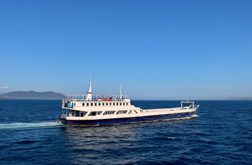 White ferry sailing in a sunny day