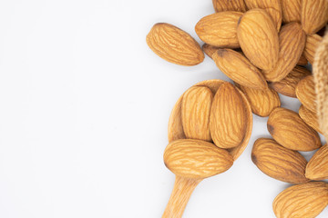 Almonds group in a wooden spoon