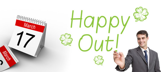 Young businessman writing something against shamrock