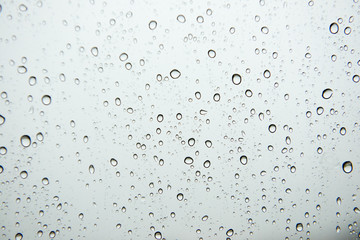 Selective focus at water drops on car glass,Rainy season