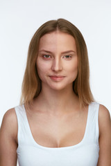Fototapeta premium Makeup. Beautiful Woman Face With And Without Foundation