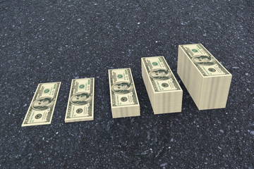 Stacks of dollars against black