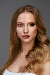 Fototapeta premium Makeup Power. Woman Face Before And After Beauty Makeup