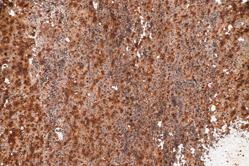 Strong corrosion of metal surface. Rust texture close up. Background image of iron garage gate...