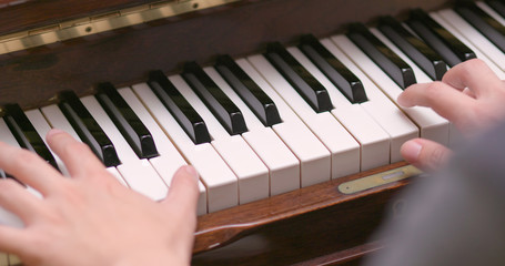 Fototapeta premium Man practicing piano