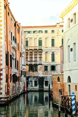 Fototapeta na wymiar A quiet, empty canal in Venice, Italy