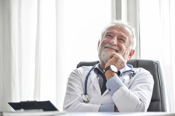 Fototapeta premium Happy Senior male Doctor is thinking.