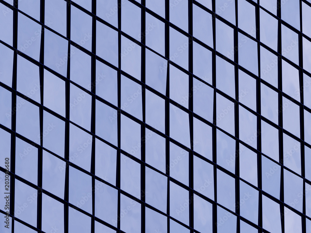 Poster View of the clouds reflected in the glass office building. 3d rendering