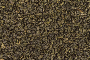 Dried leaves of green chinese gunpowder tea full frame image backgrounds