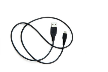 Black USB cable on white background. USB and USB-mini cable connectors close-up.