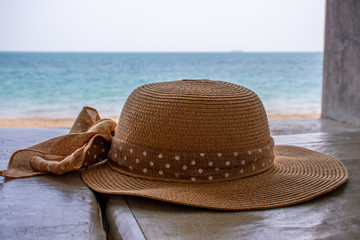 A sun hat on a beach chair in front of Long beach on the island of Koh Lanta at the Andaman coast of Thailand.
