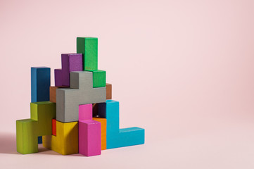Abstract construction from wooden blocks tetris shapes.