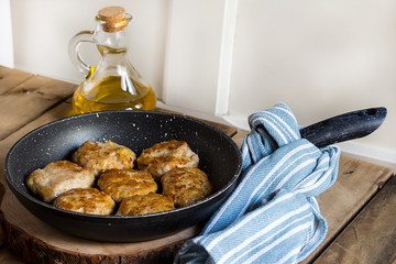 homemade cutlets on the wooden background