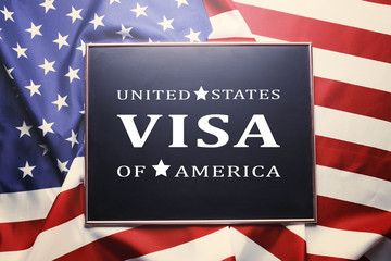 Frame with text VISA UNITED STATES OF AMERICA on USA flag background