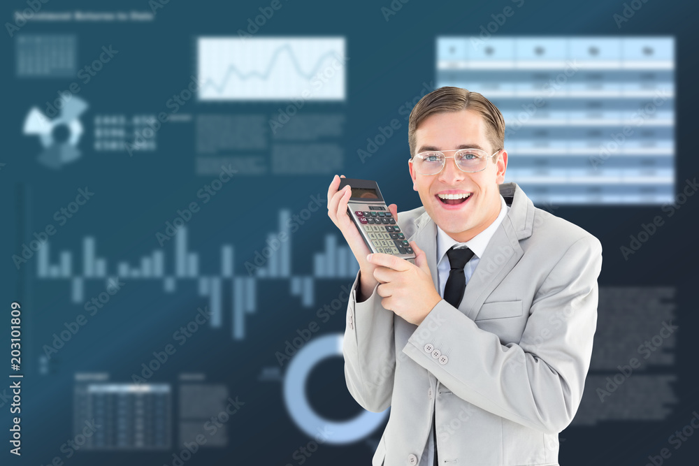 Poster Geeky smiling businessman holding calculator against business interface with graphs and data
