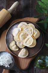 Italian Cuisine. Ricotta raw ravioli and olive oil